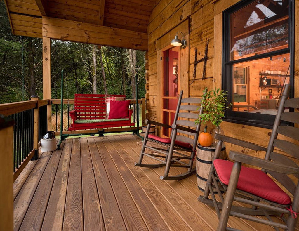 Small log cabin front porch treated with Outlast® CTA Products