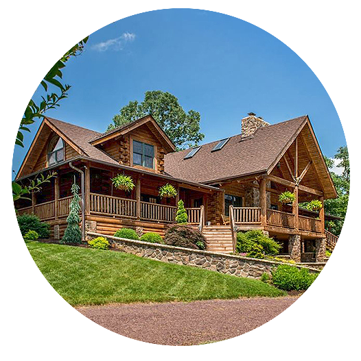 Large log home with a wrap-around front porch and a solar windows - Outlast® CTA Products
